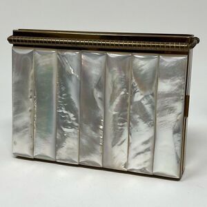 Volupte vintage MOP compact with multi compartments and original comb.